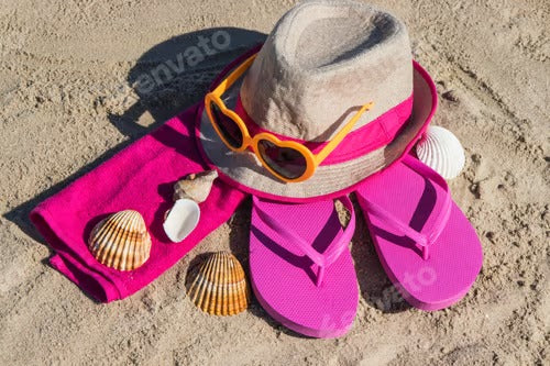 Different accessories using for relax on beach. Straw hat, flip flop, sunglasses