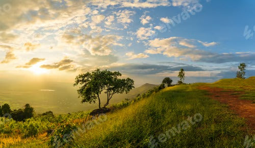 Mountain landscape with colorful vivid sunset on the cloudy sk