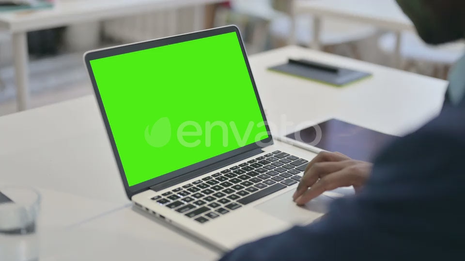 Businessman Using Laptop with Green Chroma Key Screen